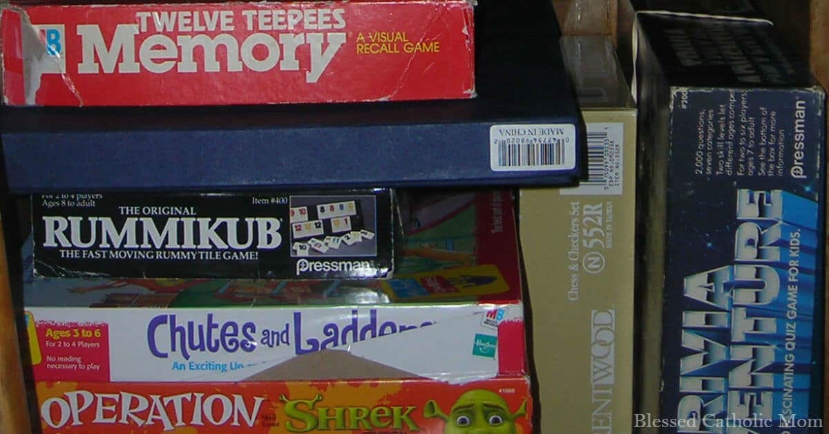 Image of a stack of games in a closet.