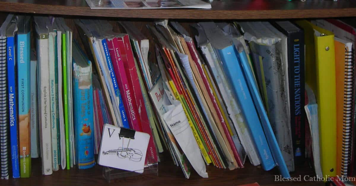 Image of a shelf of books and materials organized for the next year for a homeschooling family.