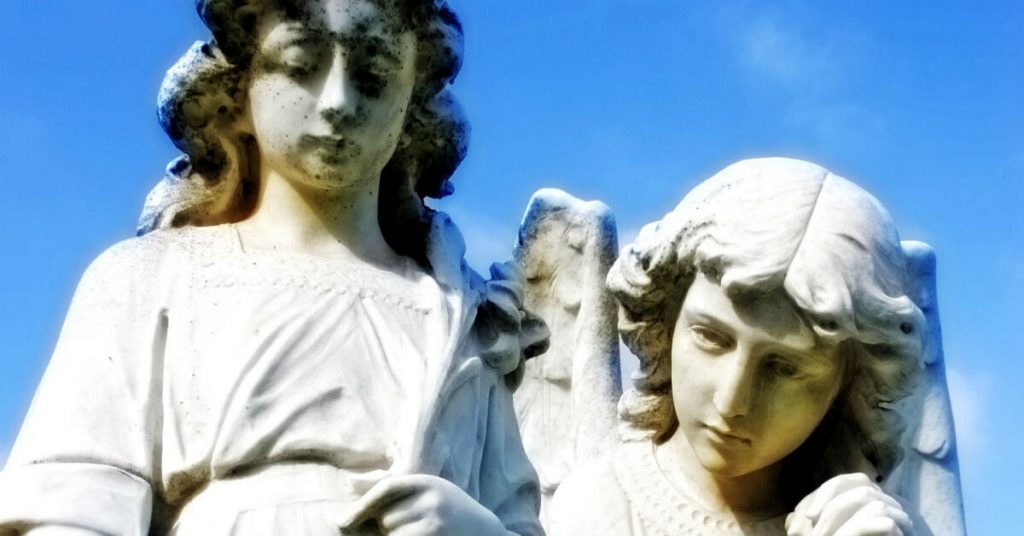 Image of two statues: a child and his Guardian Angel.