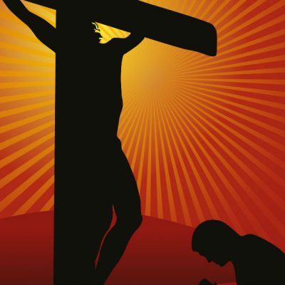 Image of a person kneeling in prayer before Jesus crucified.
