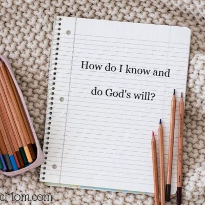 Image of a spiral notebook with lined paper open to a page that reads Howdo I know and do God's will? A pencil box with colored pencils in it is to the left of the notebook and four pencils are on the page. The logo for Blessed Catholic Mom is at the bottom of the page.