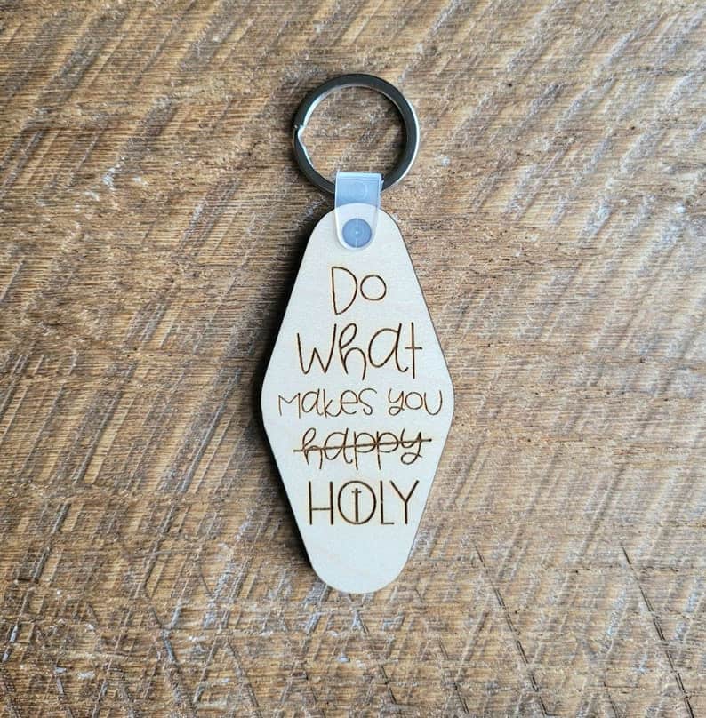 Image of a keychain wiht the words: Do what makes you holy.