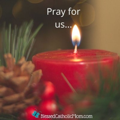 Image of a red lit candle wiht soem greenery, a pinecone, and red berries. At the top of the image oare the words Pray for us... and at the bottom of the image is the logo for Blessed Catholic Mom.
