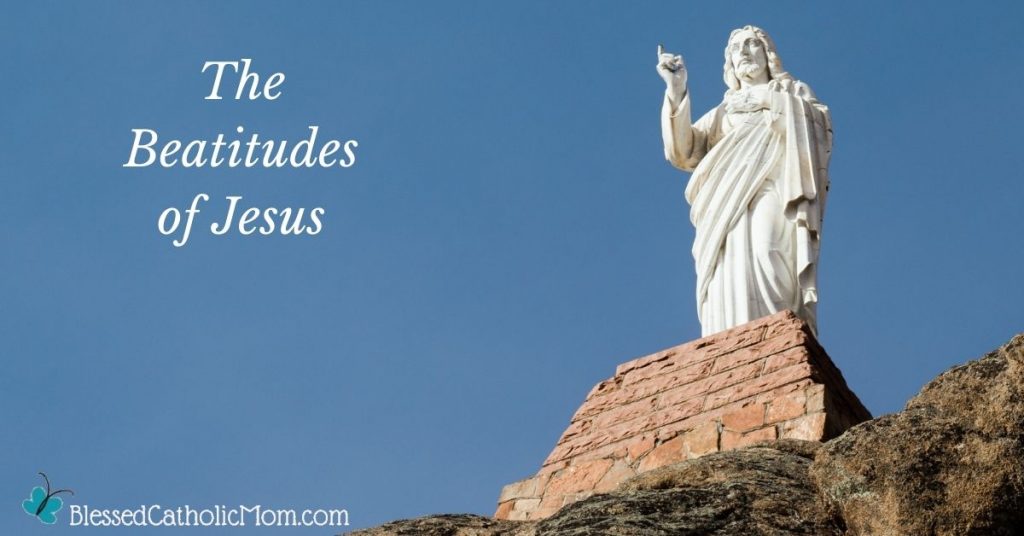 Image of a white statue of Jesus on a mountain. The words The Beatitudes of Jesus are on the blue sky and the logo for Blessed Catholic mom is at the bottom of the image.