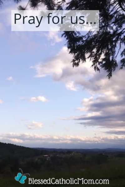 Image of a tree with hills and skyline in the background. Words at the top of the image read Pray for us... Logo for Blessed Catholic Mom at the bottom of the image.