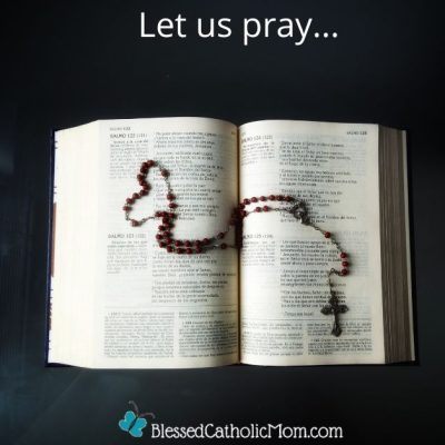 Image of an open Bible with a Rosary on it; part of the Rosary is in the shape of a heart. Let us pray... is above the image and the logo for Blessed Catholic Mom is below it.